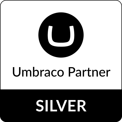 http://testing.tkg.com/wp-content/uploads/2026/10/silver_vertical_partner_badge_black.png